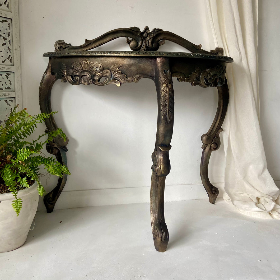 Carved console table, bronze