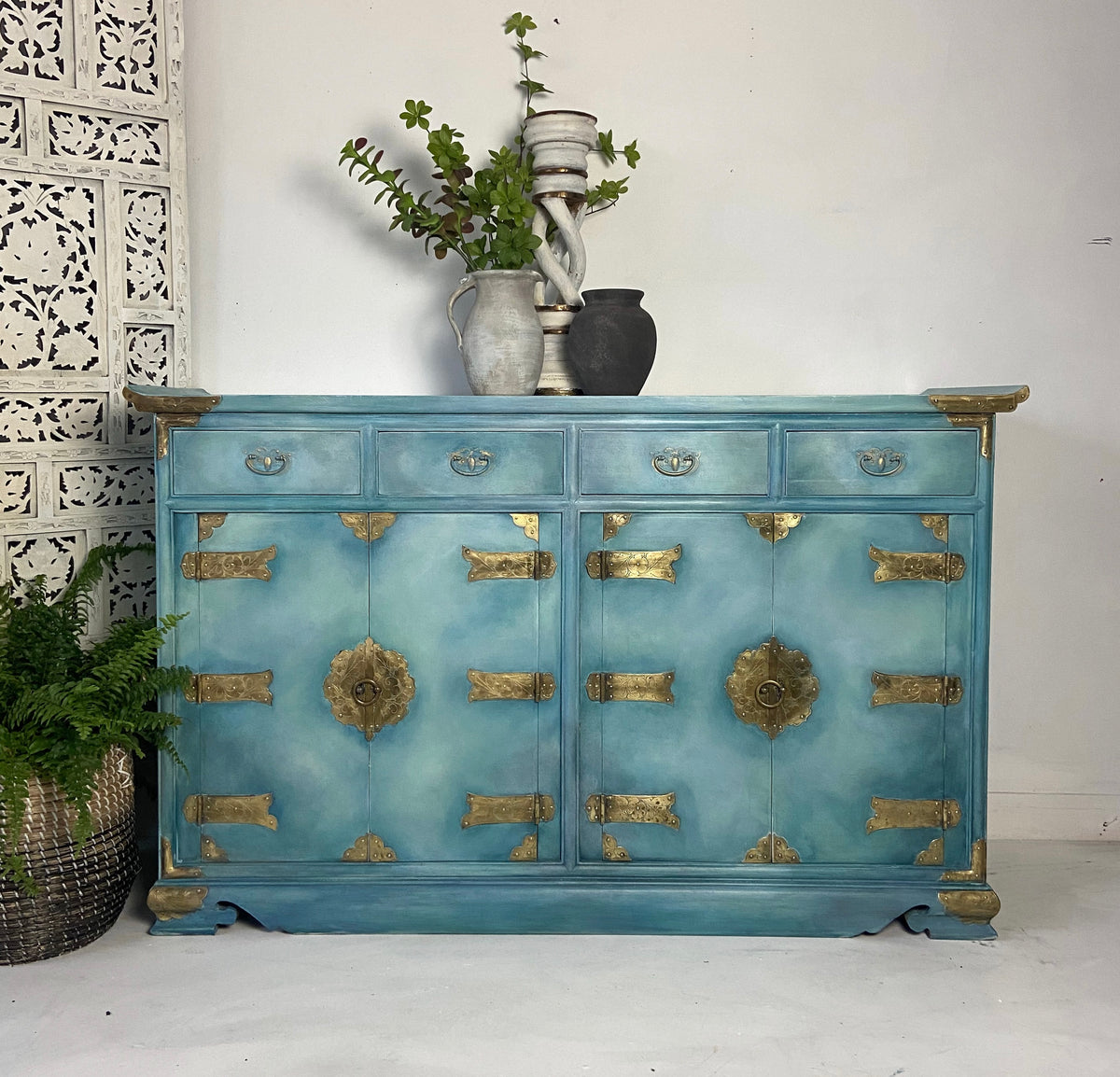 Asian style sideboard hand painted with blends and layers reminiscent of the ocean. 