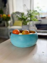 Load image into Gallery viewer, Blue turquoise wooden bowl with fruits on a table in a blurred indoor setting
